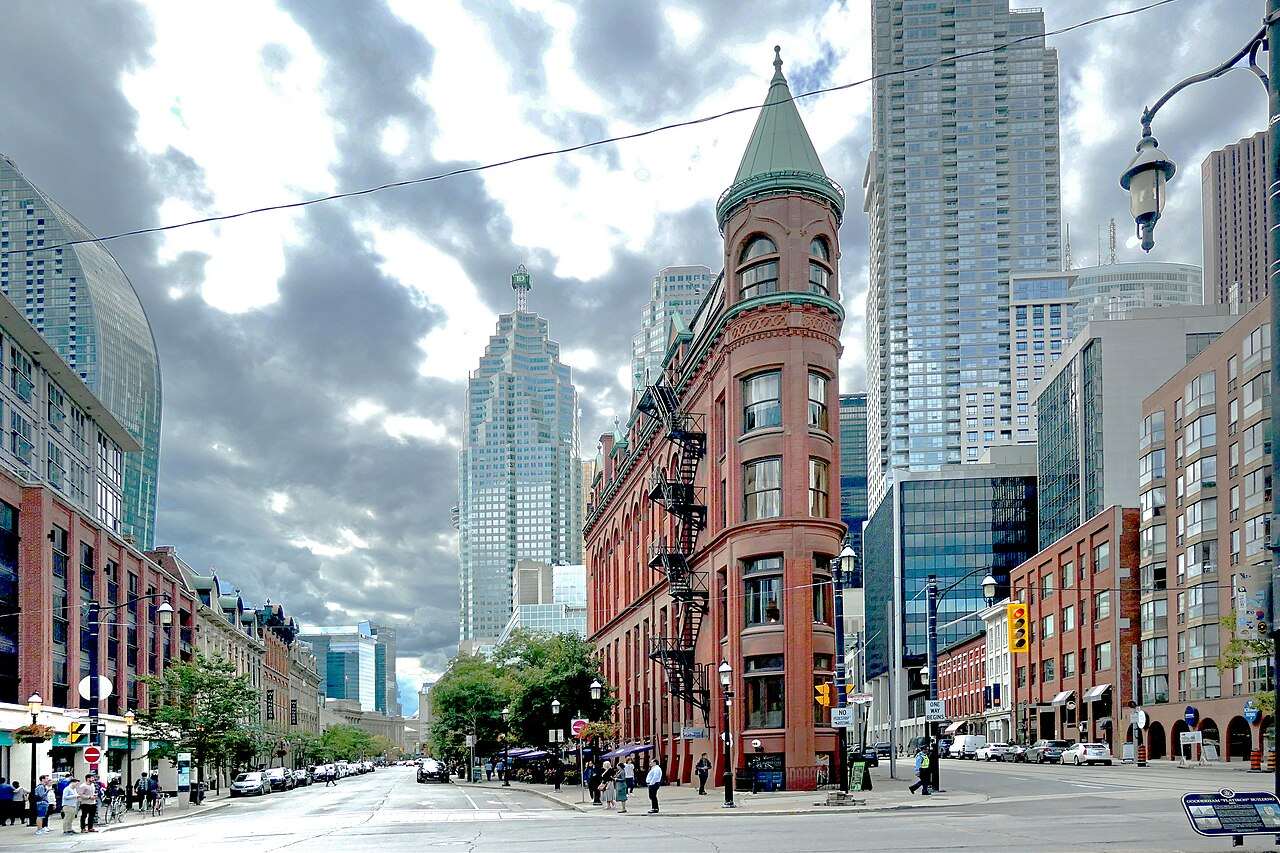 The narrow wedge-shaped Gooderham Building, Toronto's Flatiron, framed by modern skyscrapers