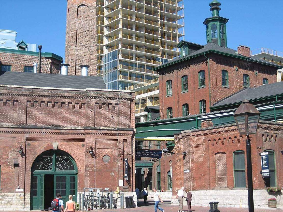 Historic red-brick Victorian buildings along a cobblestone lane in the Distillery District