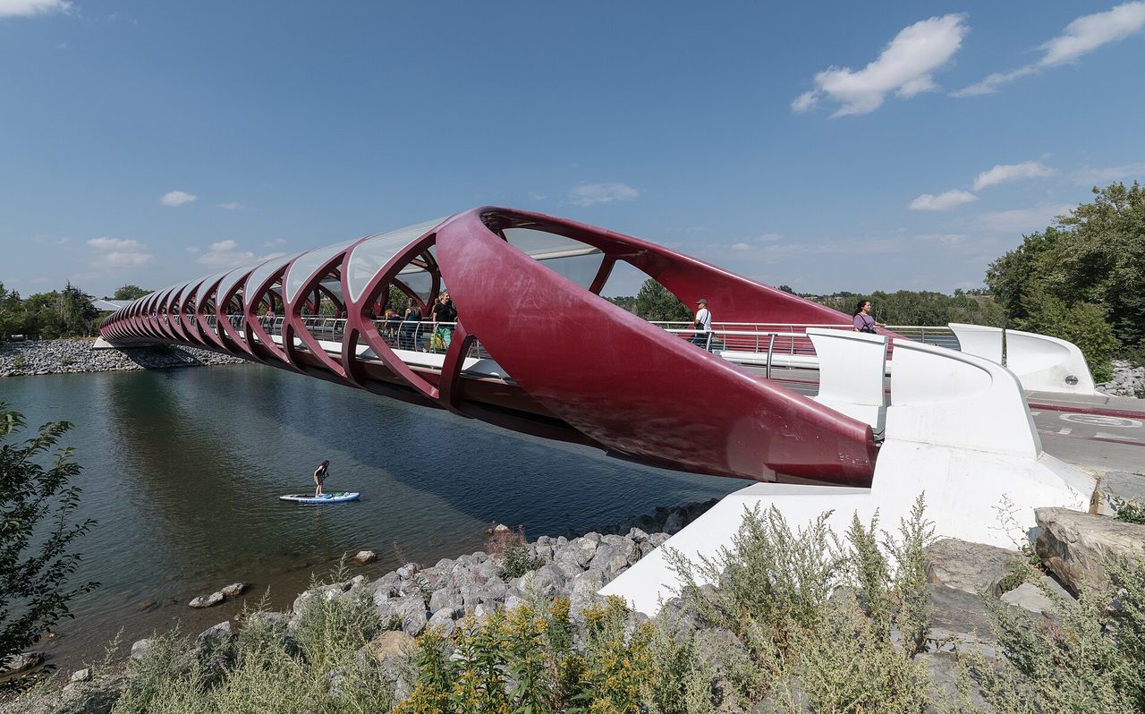 The red Peace Bridge pedestrian crossing spanning the Bow River in Calgary