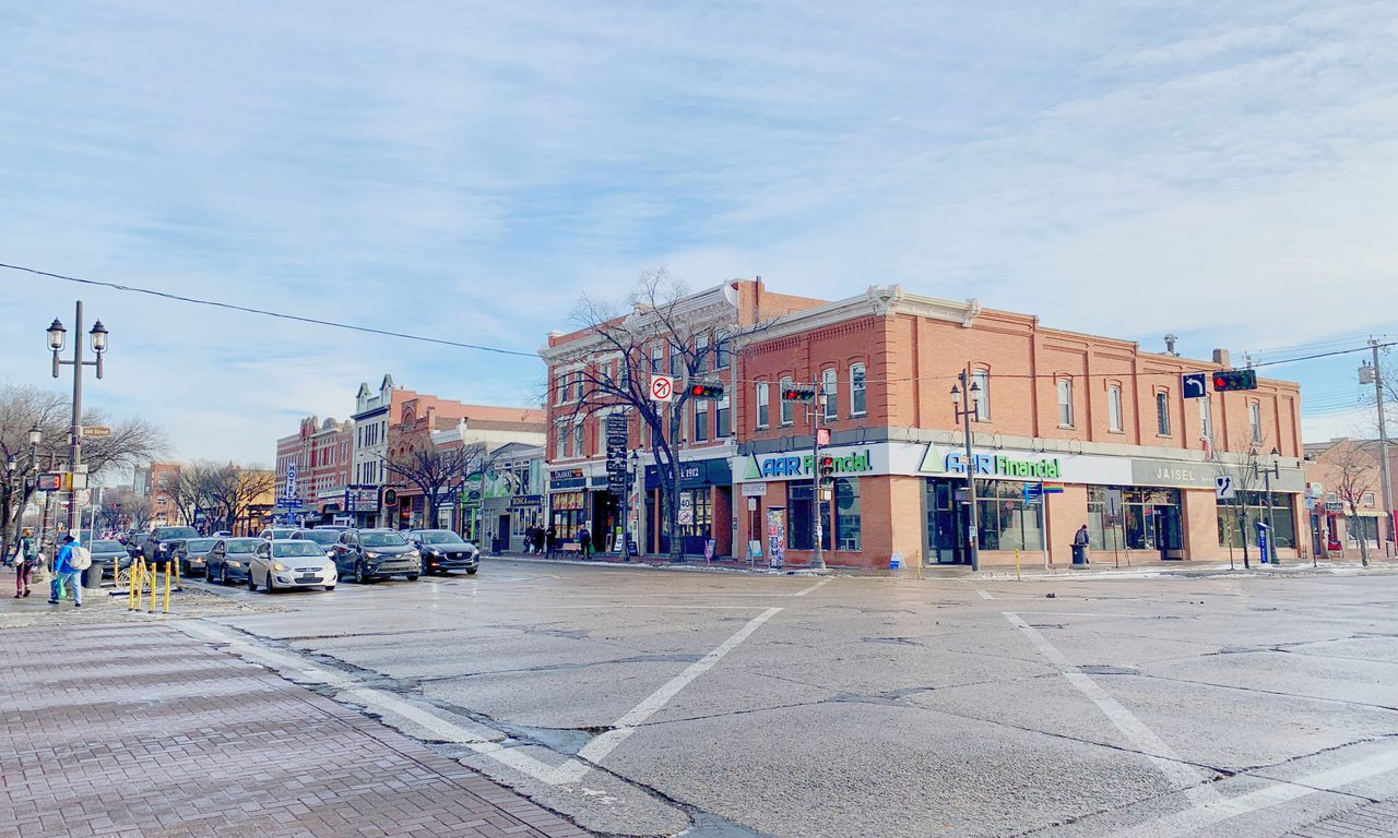 Historic brick storefronts along Whyte Avenue in Old Strathcona, Edmonton