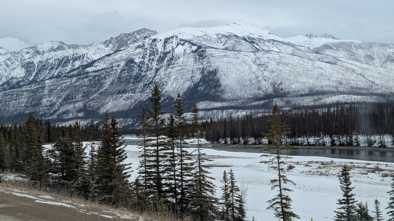 Medicine Lake stretching between forested mountains in Jasper National Park