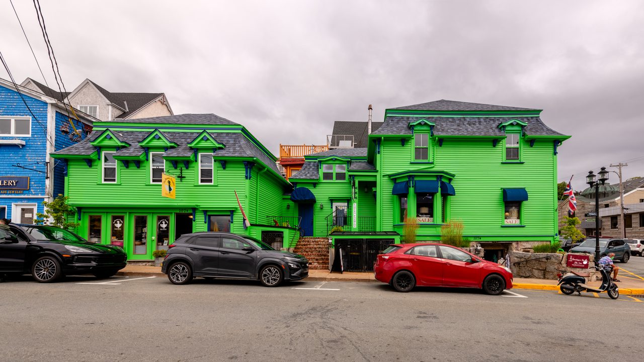 Row of brightly painted historic wooden houses on Montague Street in Old Town Lunenburg