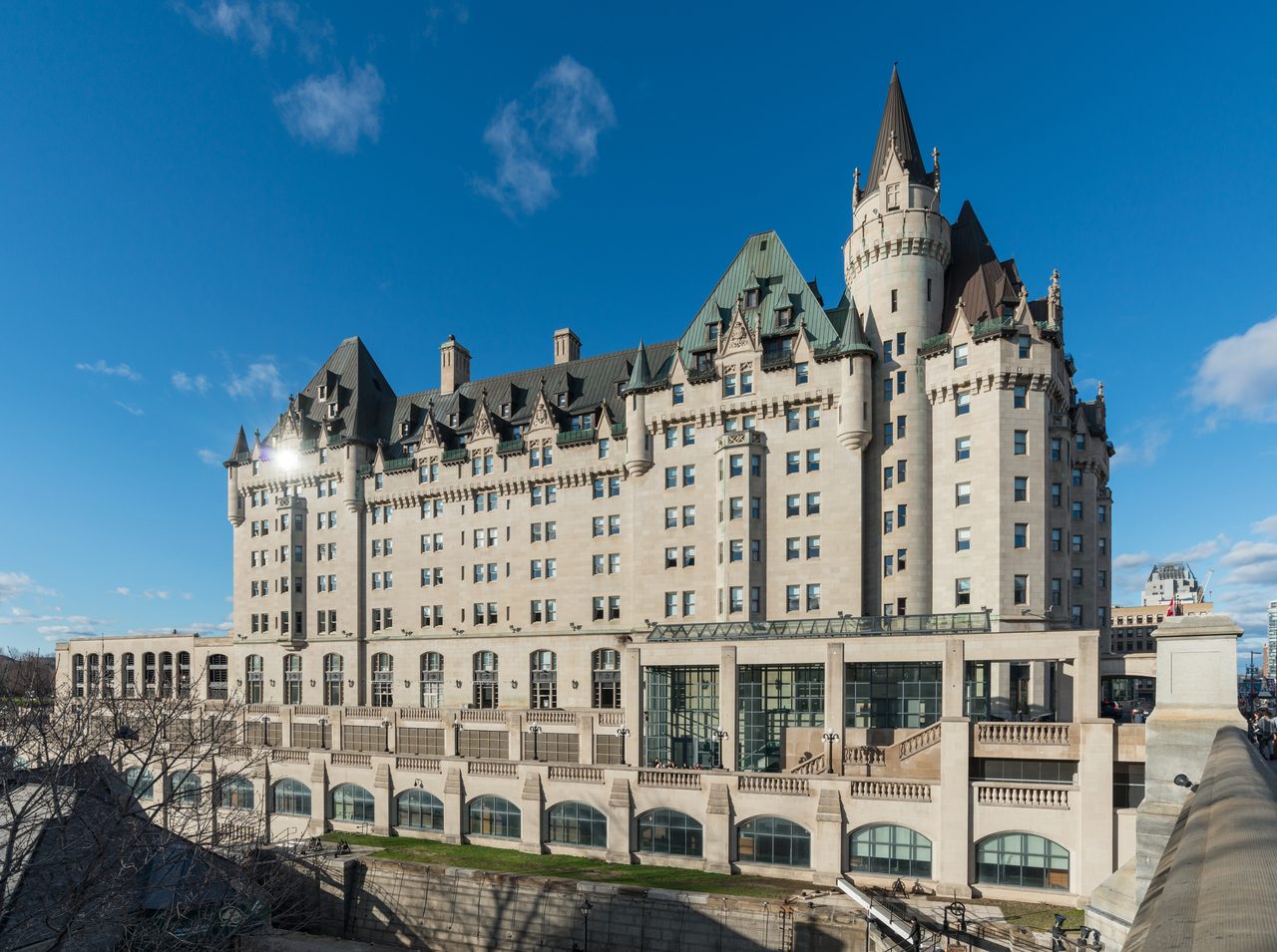 Fairmont Château Laurier viewed from across the Rideau Canal on a sunny day