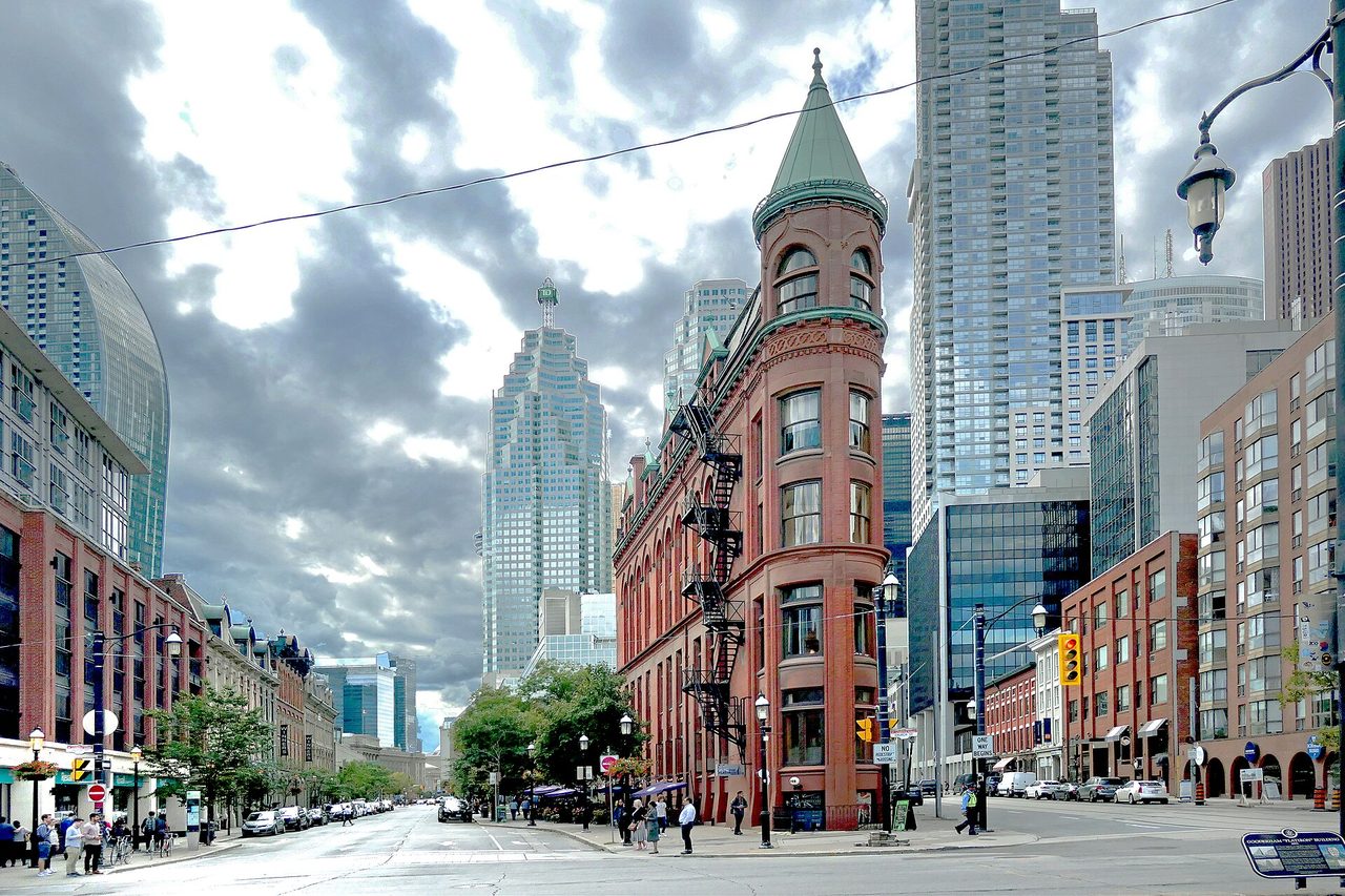 The narrow wedge-shaped Gooderham Building, Toronto's Flatiron, framed by modern skyscrapers