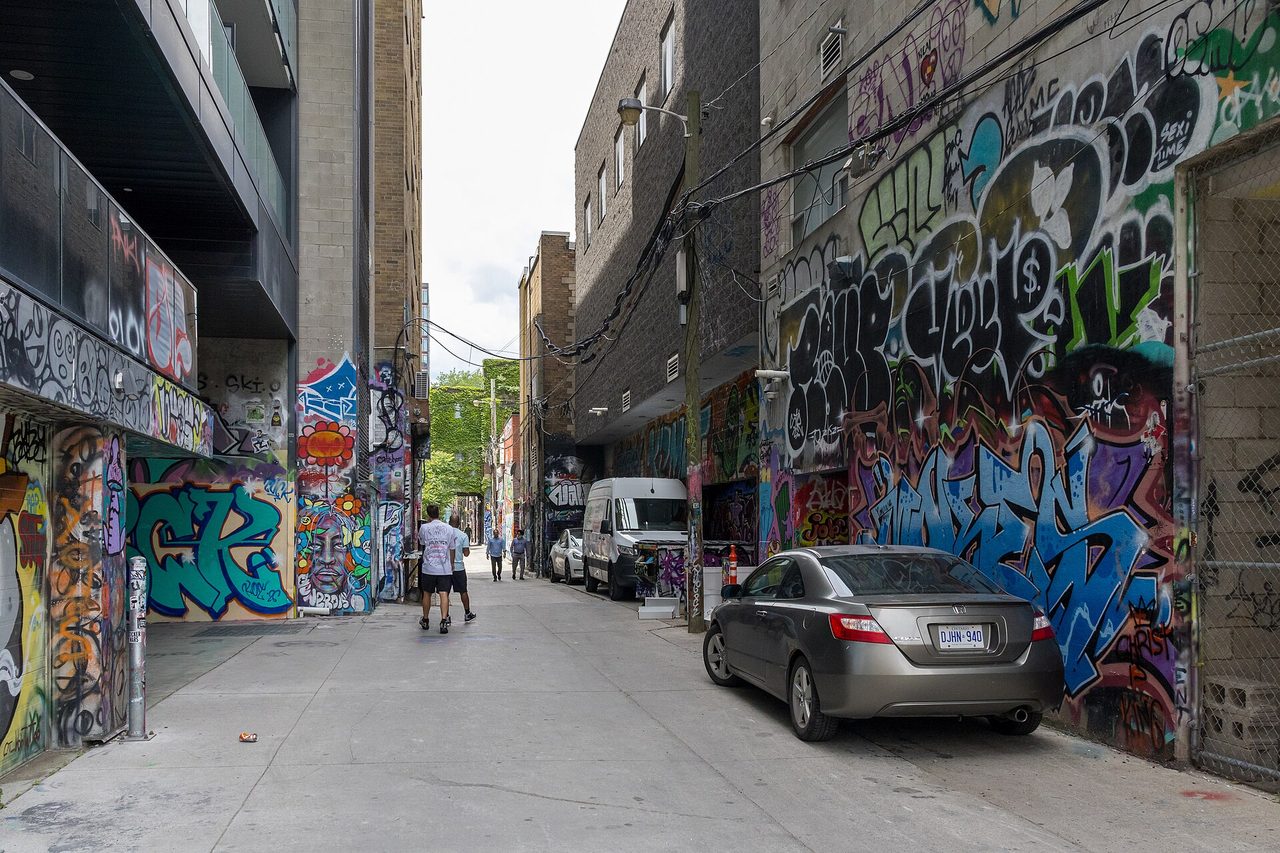 Colourful street-art murals covering the walls of Graffiti Alley in Toronto