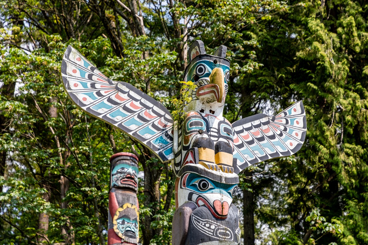 Close view of the colorful First Nations totem poles at Brockton Point in Stanley Park