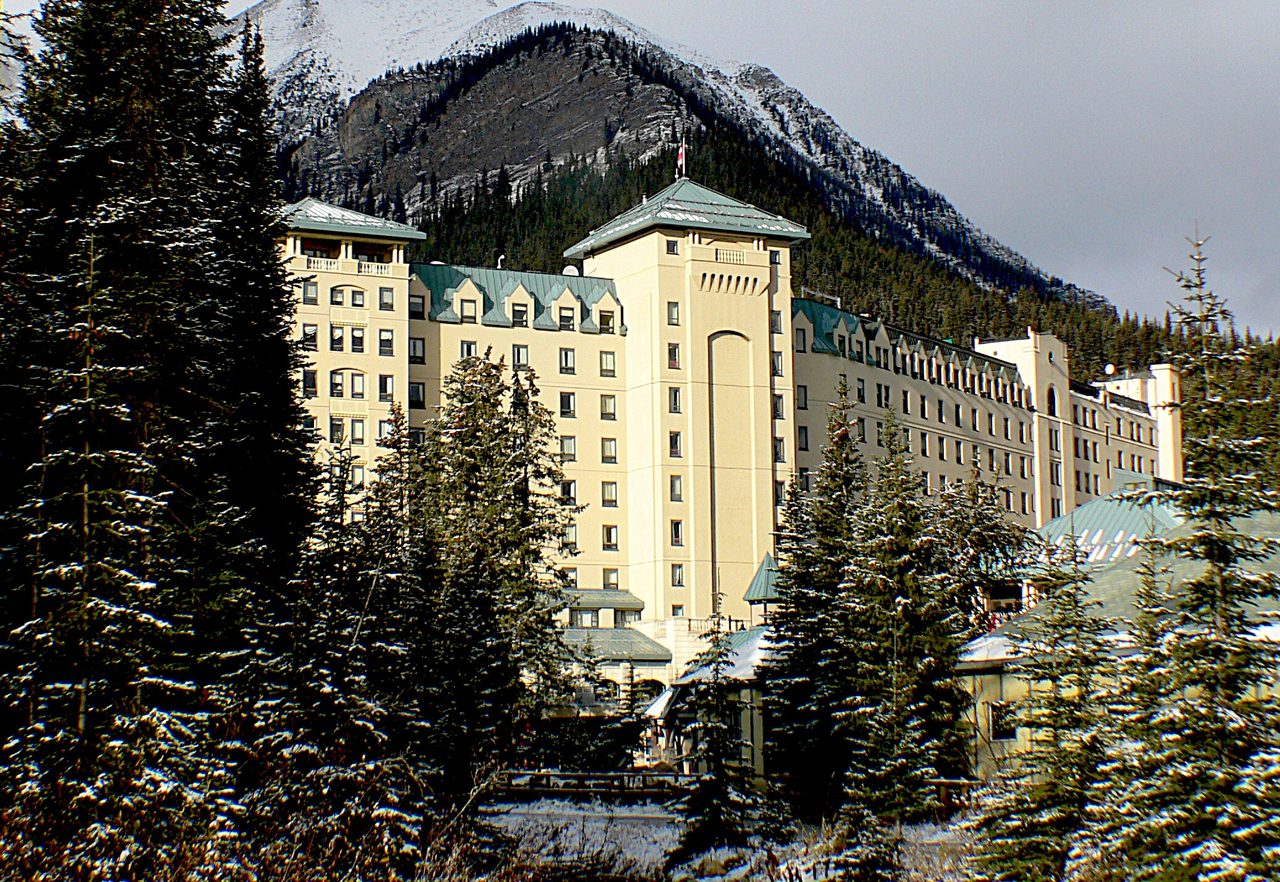 Lake Louise's turquoise water and the Victoria Glacier behind the Fairmont Chateau