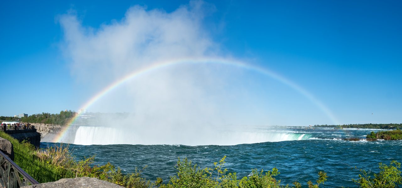 A rainbow arching over Horseshoe Falls at Niagara Falls