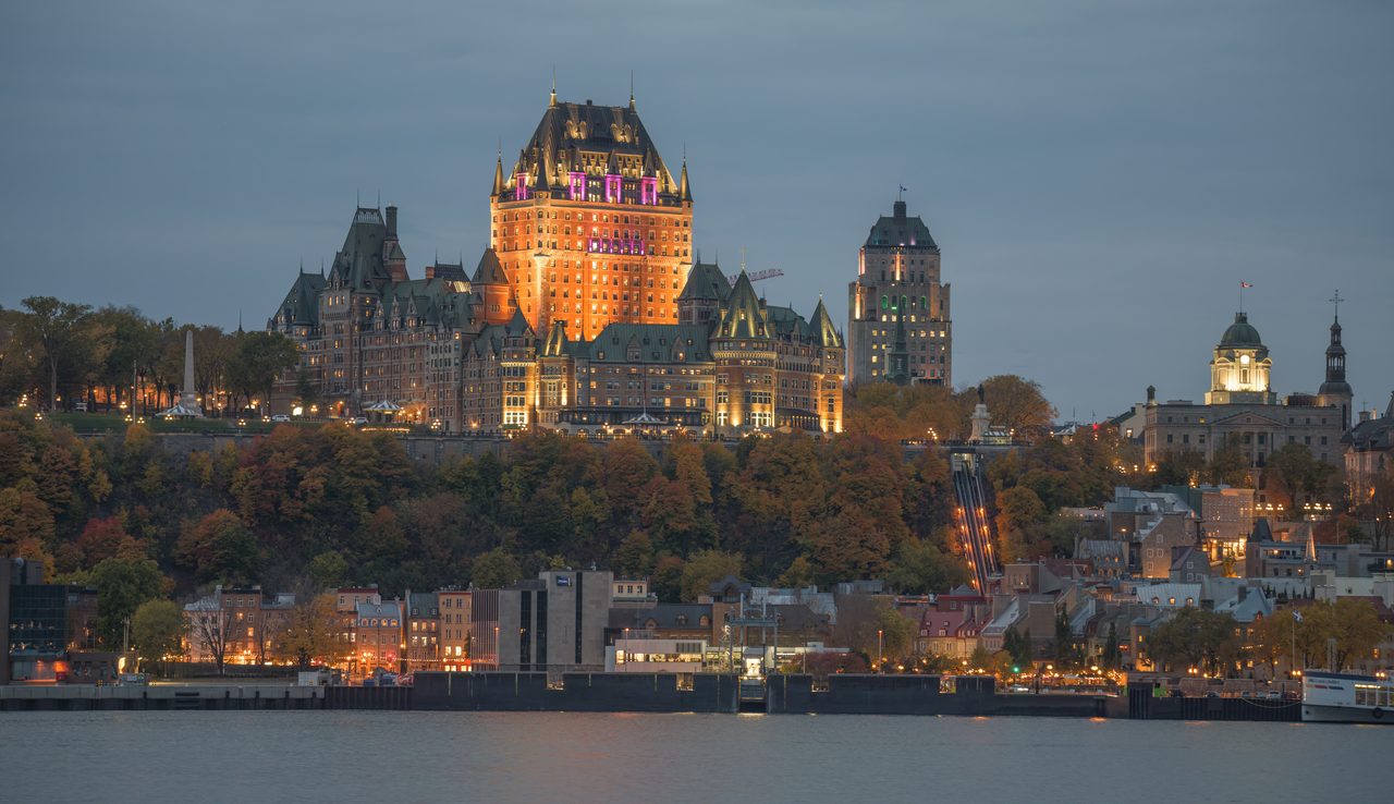 Chateau Frontenac rising above Old Quebec in full autumn color