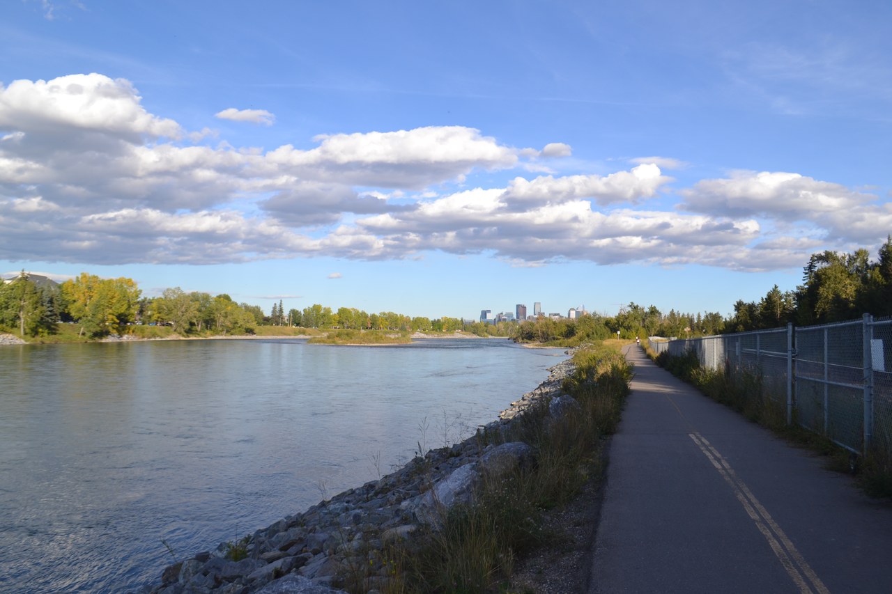 The Bow River flowing through Calgary with the downtown skyline beyond