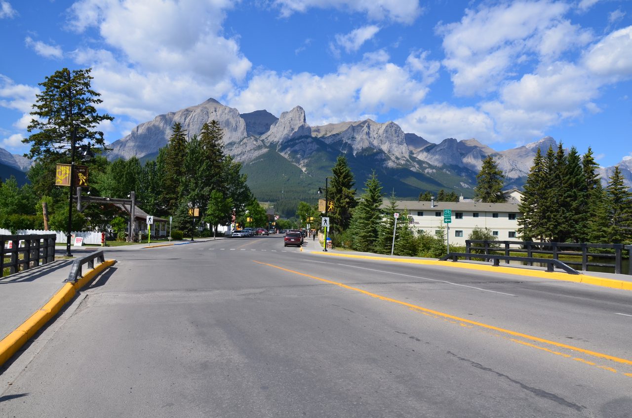 Main Street in Canmore with mountain views and local storefronts