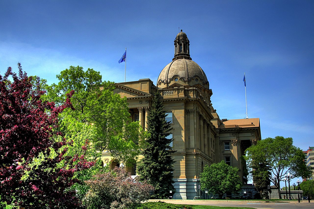 Beaux-Arts Alberta Legislature Building with its central dome above the river valley grounds
