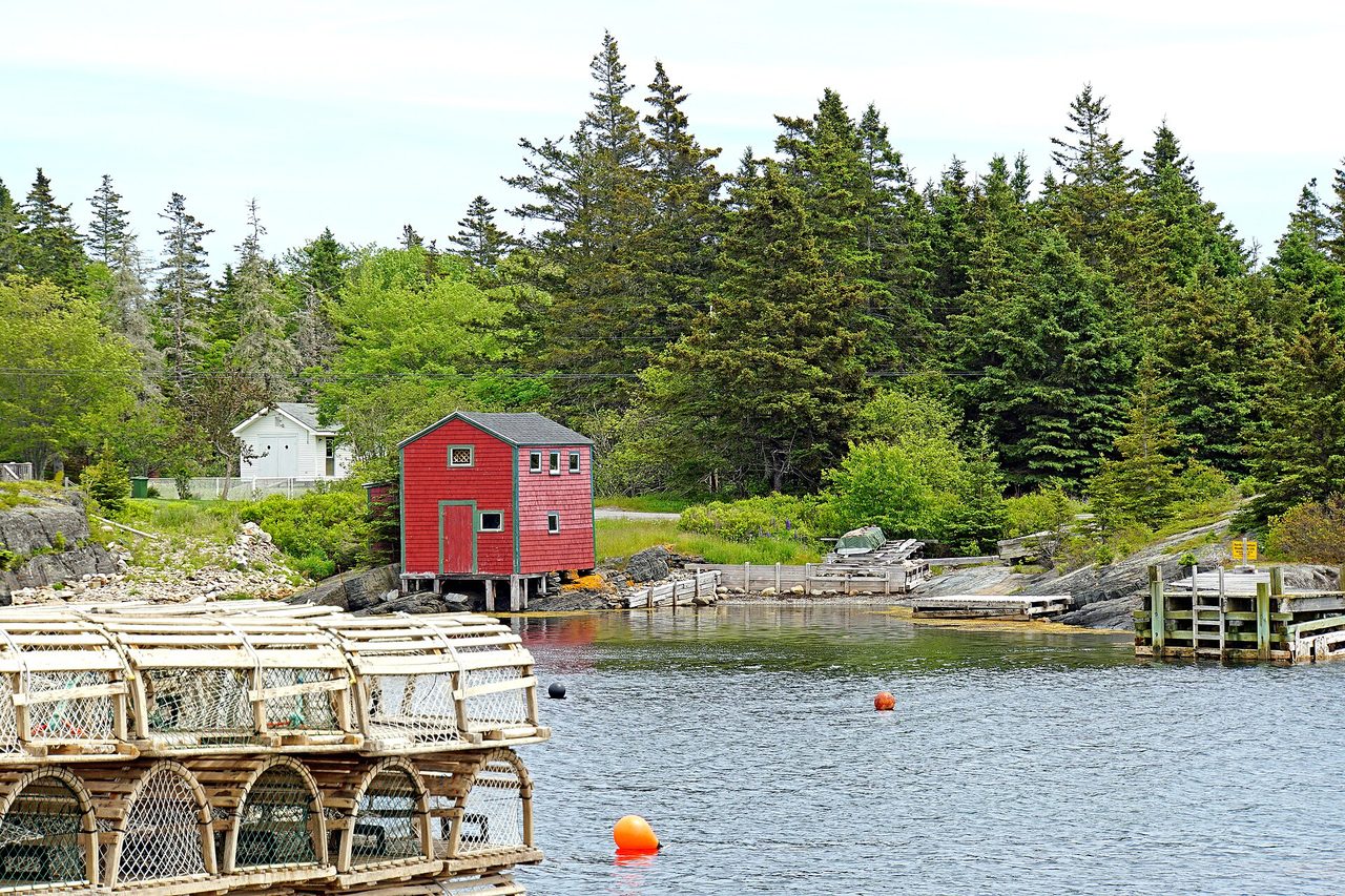 Blue-grey slate rocks and fishing huts at Blue Rocks near Lunenburg, Nova Scotia