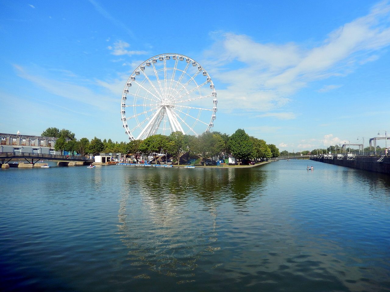La Grande Roue observation wheel rising over the Old Port of Montreal at golden hour