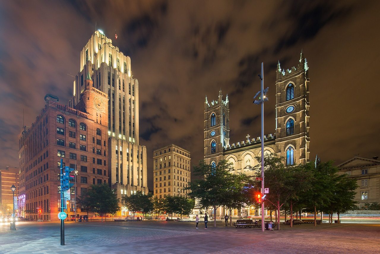 Neo-Gothic twin towers of Notre-Dame Basilica on Place d'Armes in Old Montreal