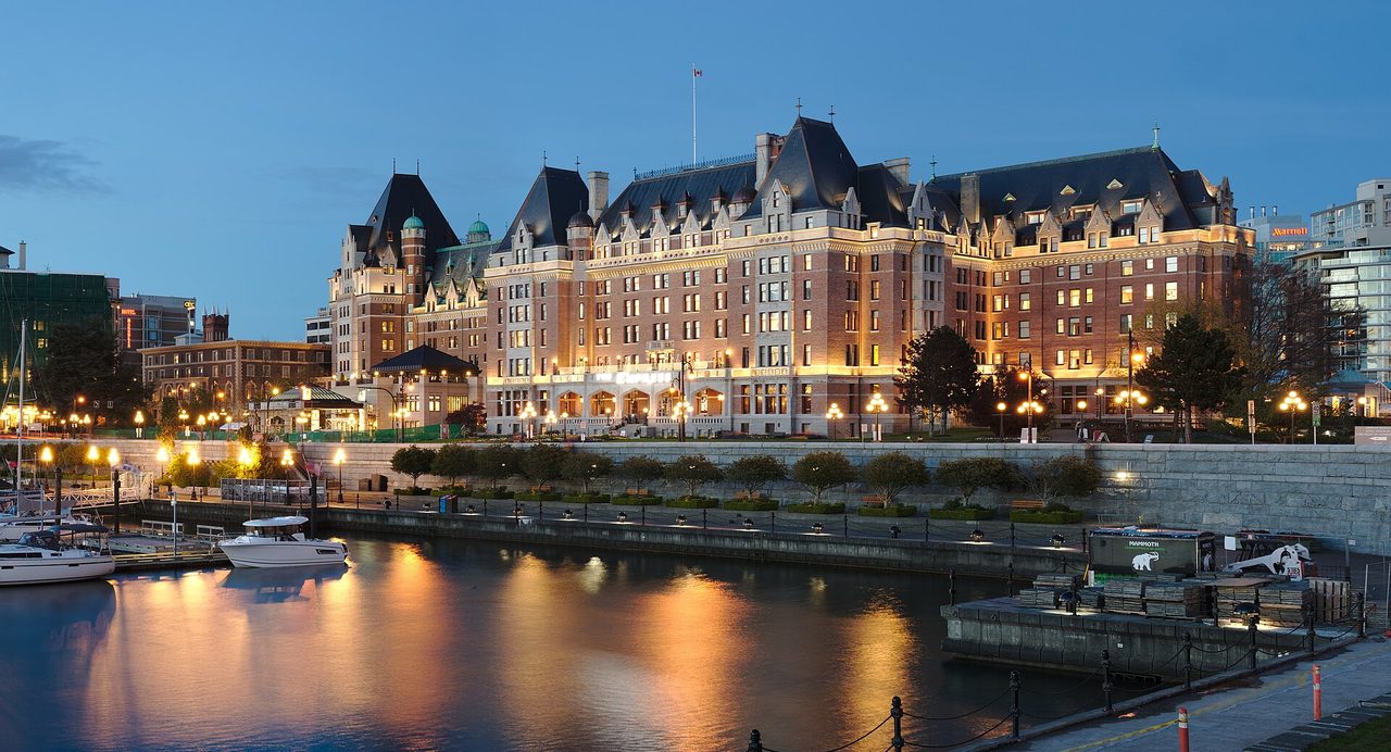 The Fairmont Empress Hotel glowing at blue hour on Victoria's Inner Harbour