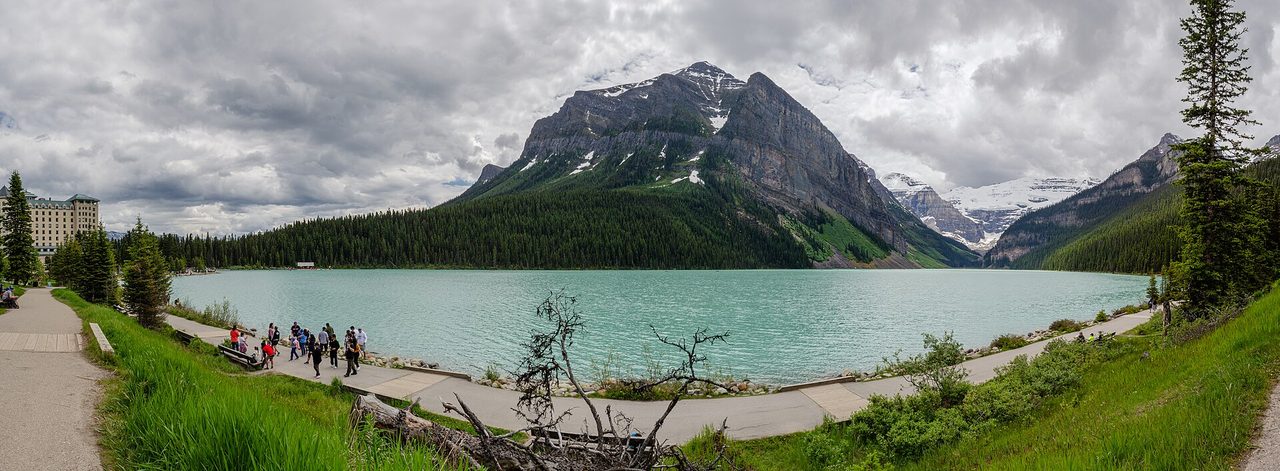 Panorama of Lake Louise with Mount Victoria rising behind the milky turquoise water
