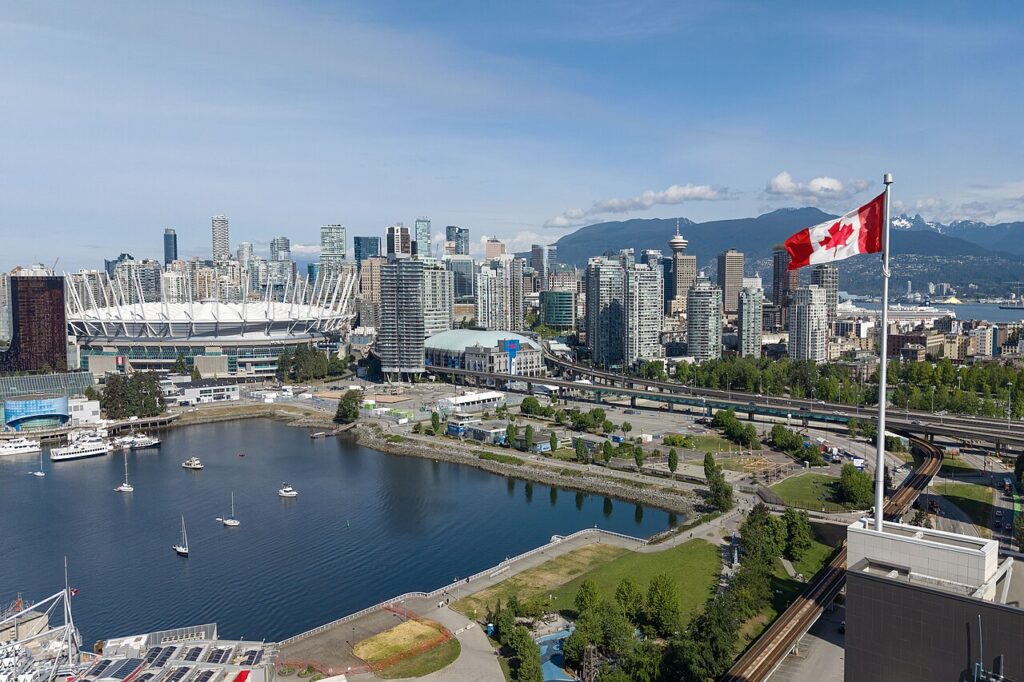 Vancouver skyline across False Creek with the Canadian flag