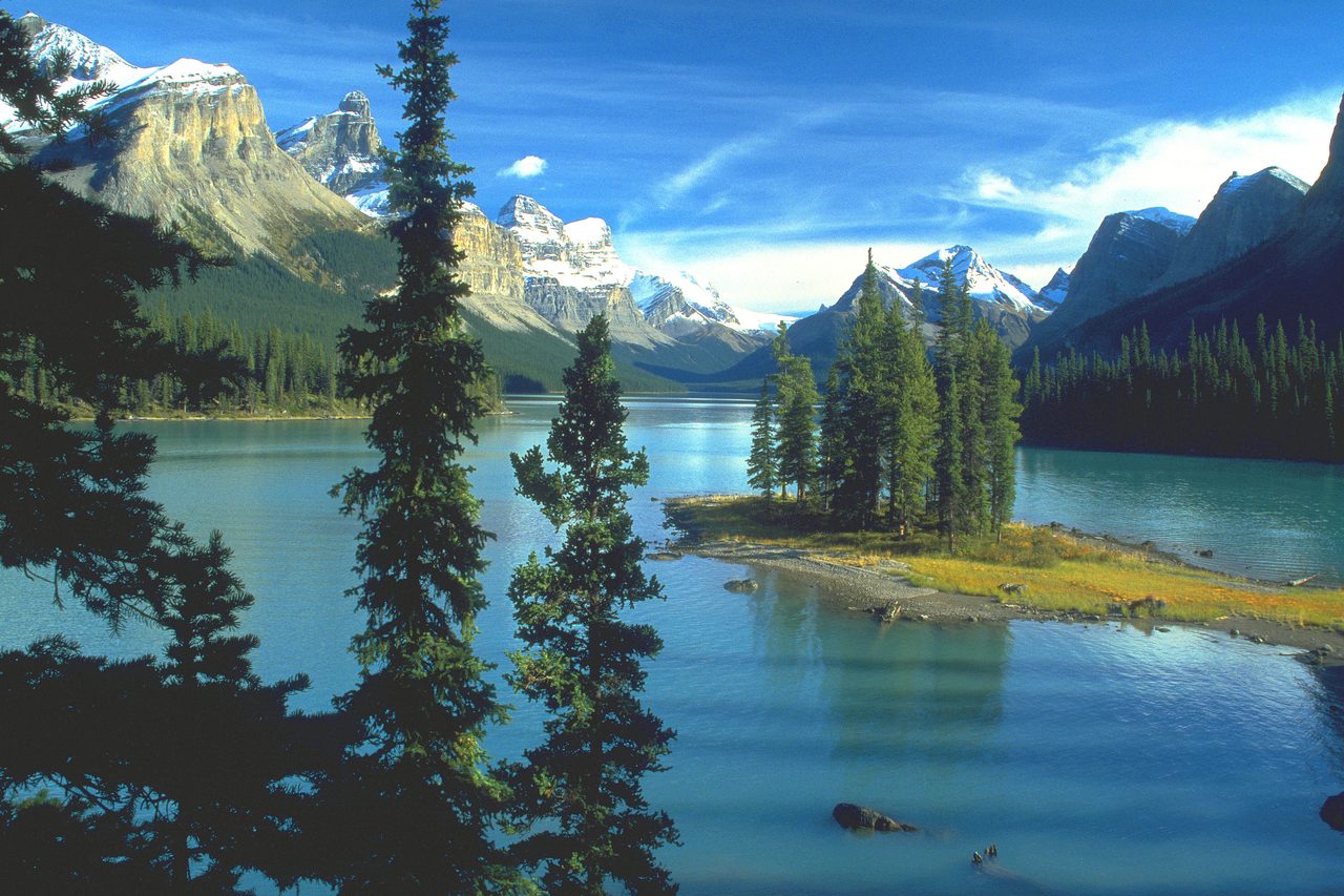 Spirit Island on Maligne Lake with glacier-hung peaks behind it