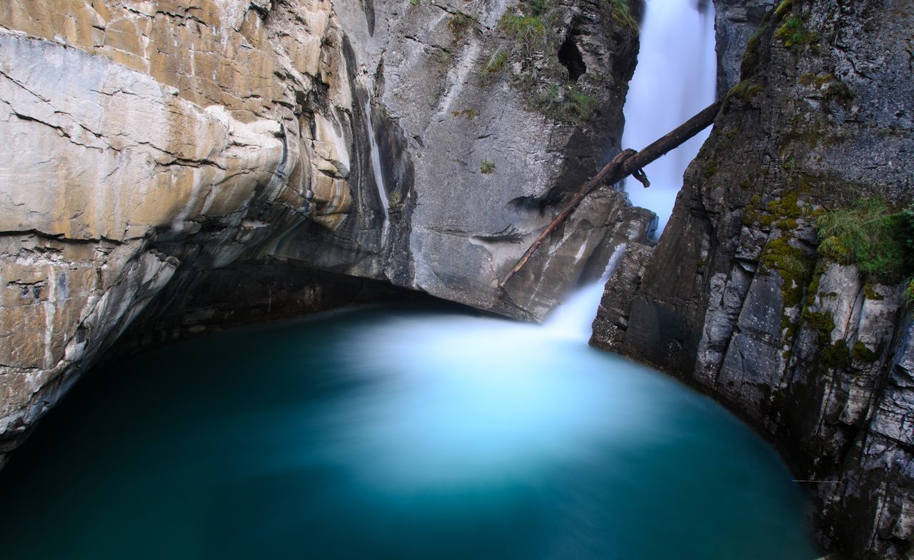 Lower Falls thundering through the limestone walls of Johnston Canyon