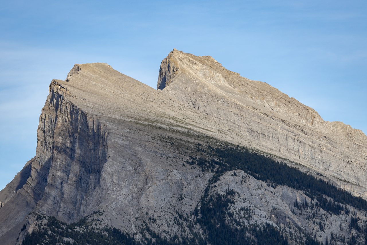 Mount Rundle reflected in the calm Vermilion Lakes at the edge of the Banff townsite