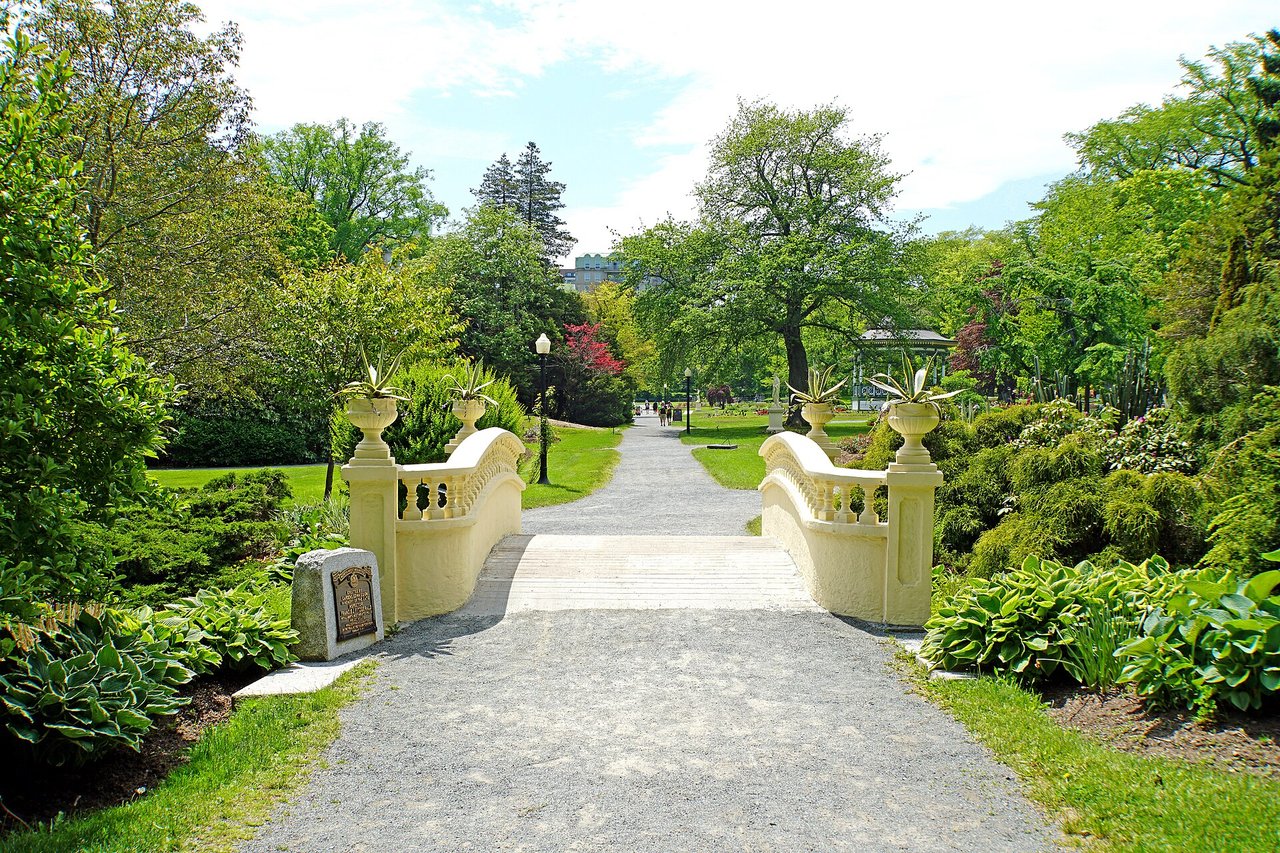 Manicured flower beds and lawns in the Halifax Public Gardens on a summer day
