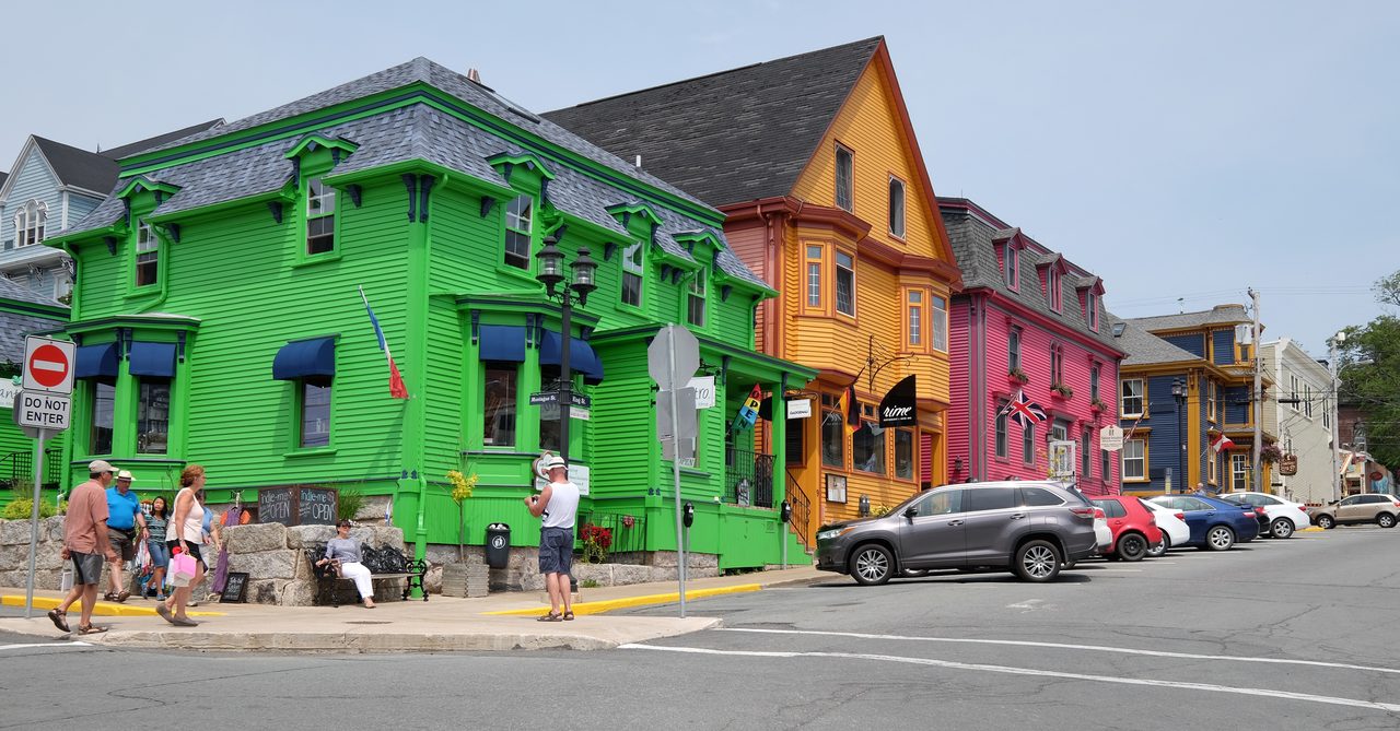 Colorful historic wooden houses lining a street in Old Town Lunenburg