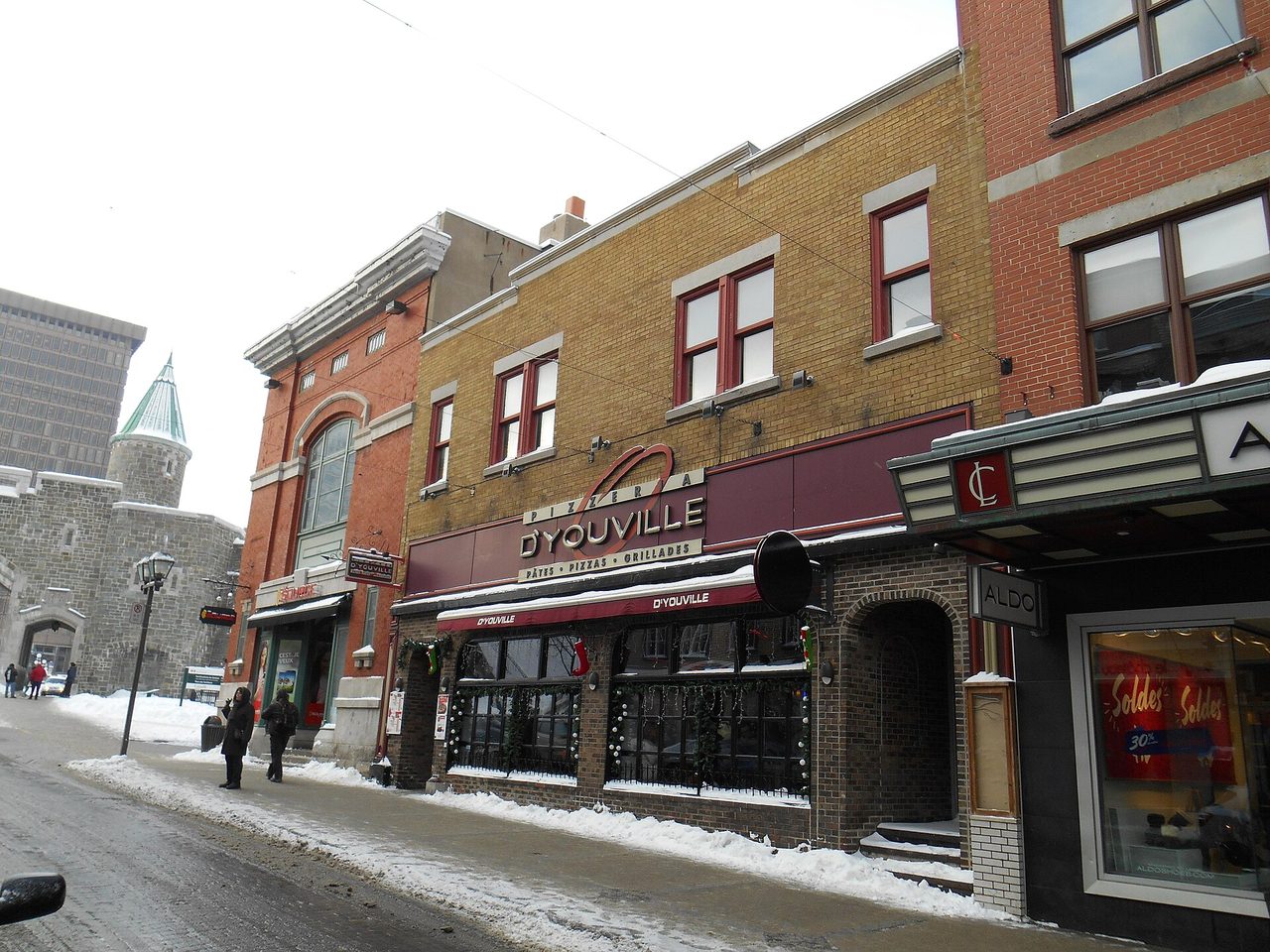 Colorful brick storefronts and restaurants on Rue Saint-Jean in winter, Saint-Jean-Baptiste district