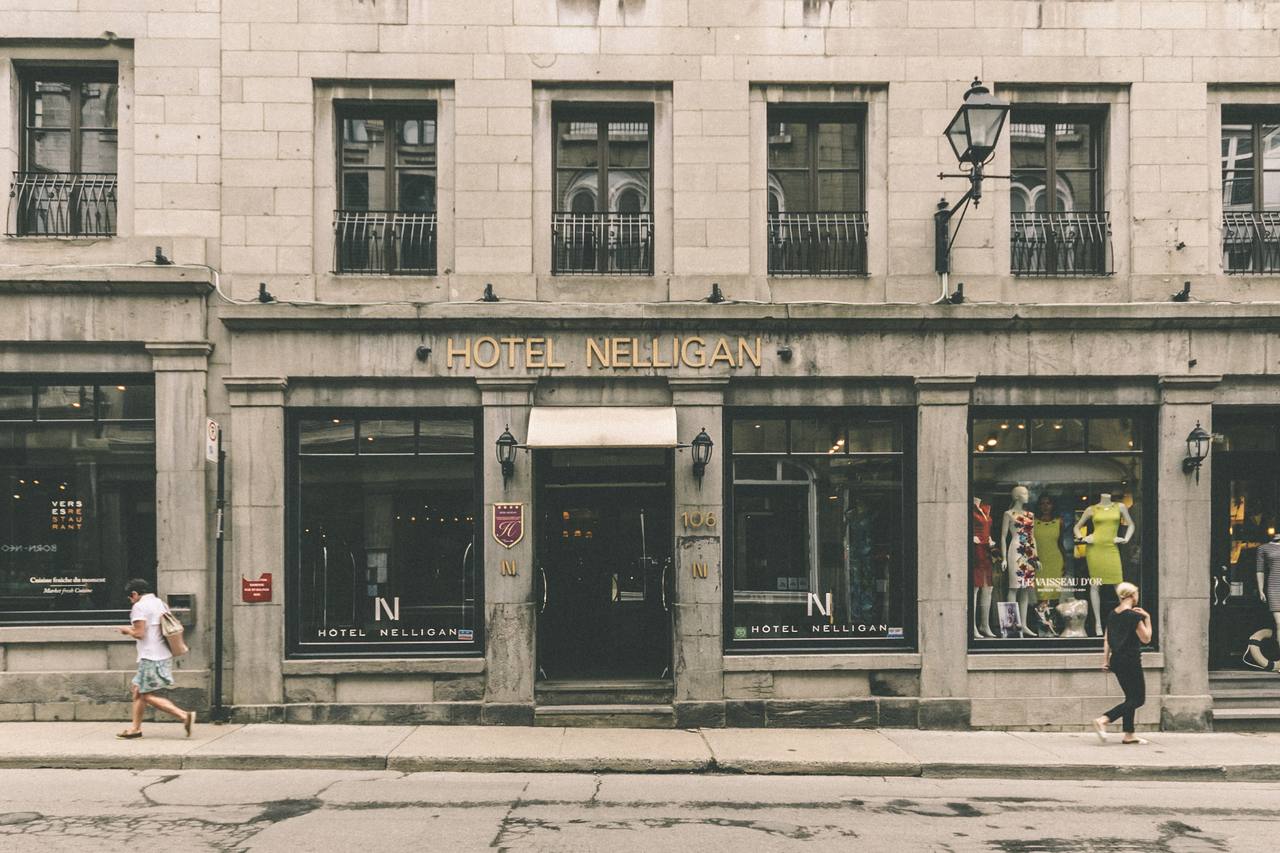Historic stone facade of Hotel Nelligan on Rue Saint-Paul in Old Montreal