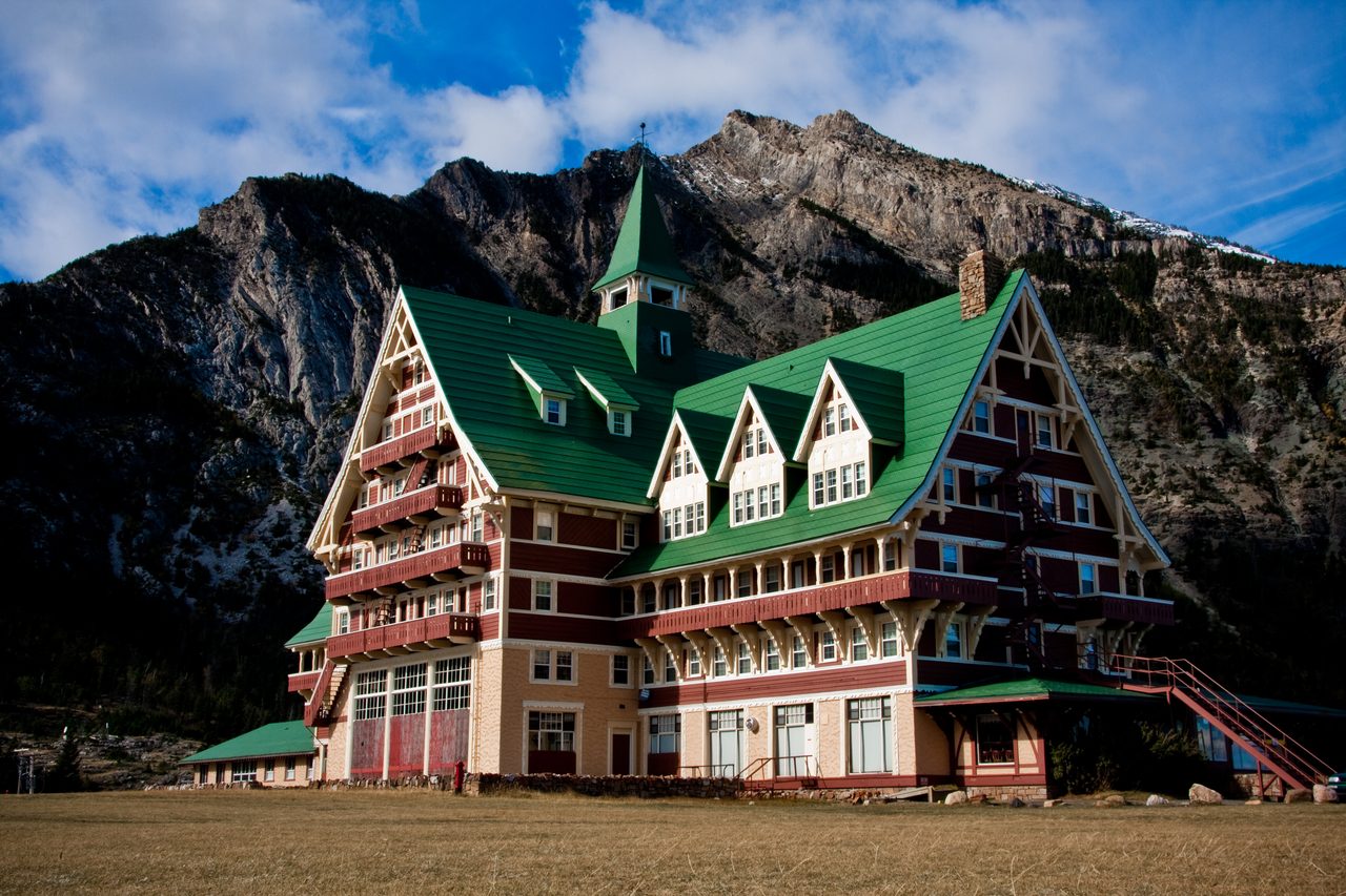 Historic Prince of Wales Hotel on a bluff above Upper Waterton Lake