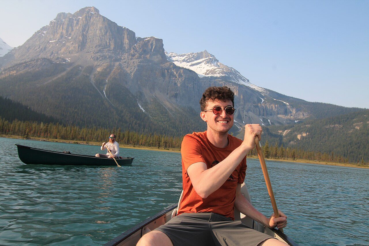 Red canoes on the turquoise water of Emerald Lake in Yoho National Park