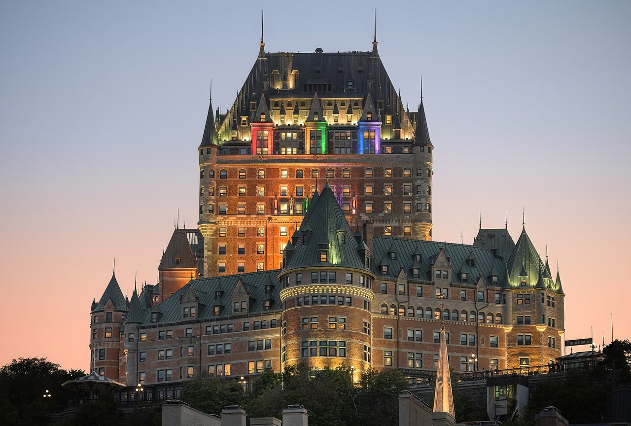Château Frontenac illuminated at dusk in Old Quebec City