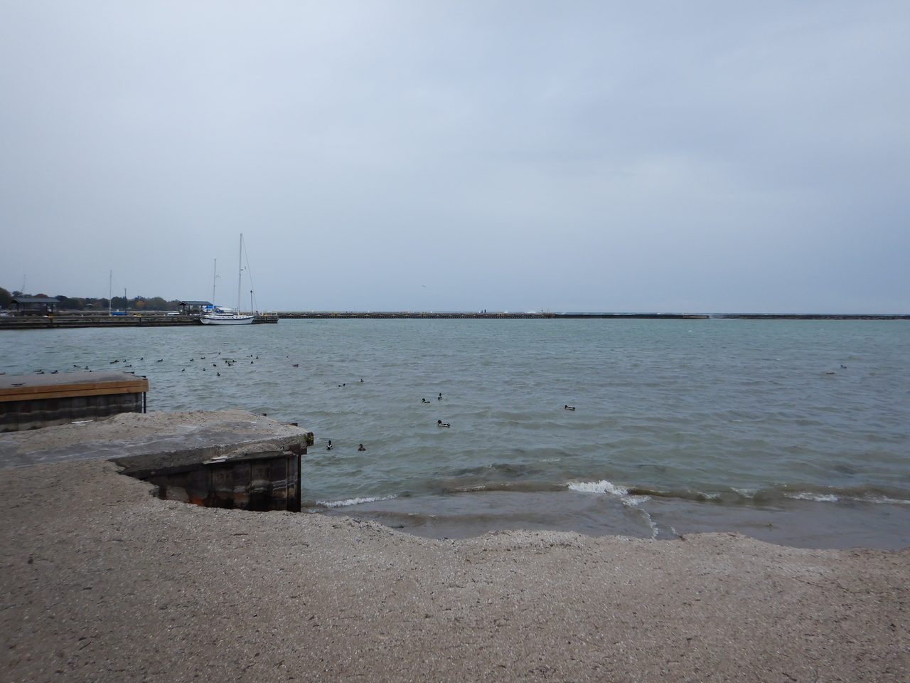 Sandy beach at Cobourg Ontario on Lake Ontario with calm summer water