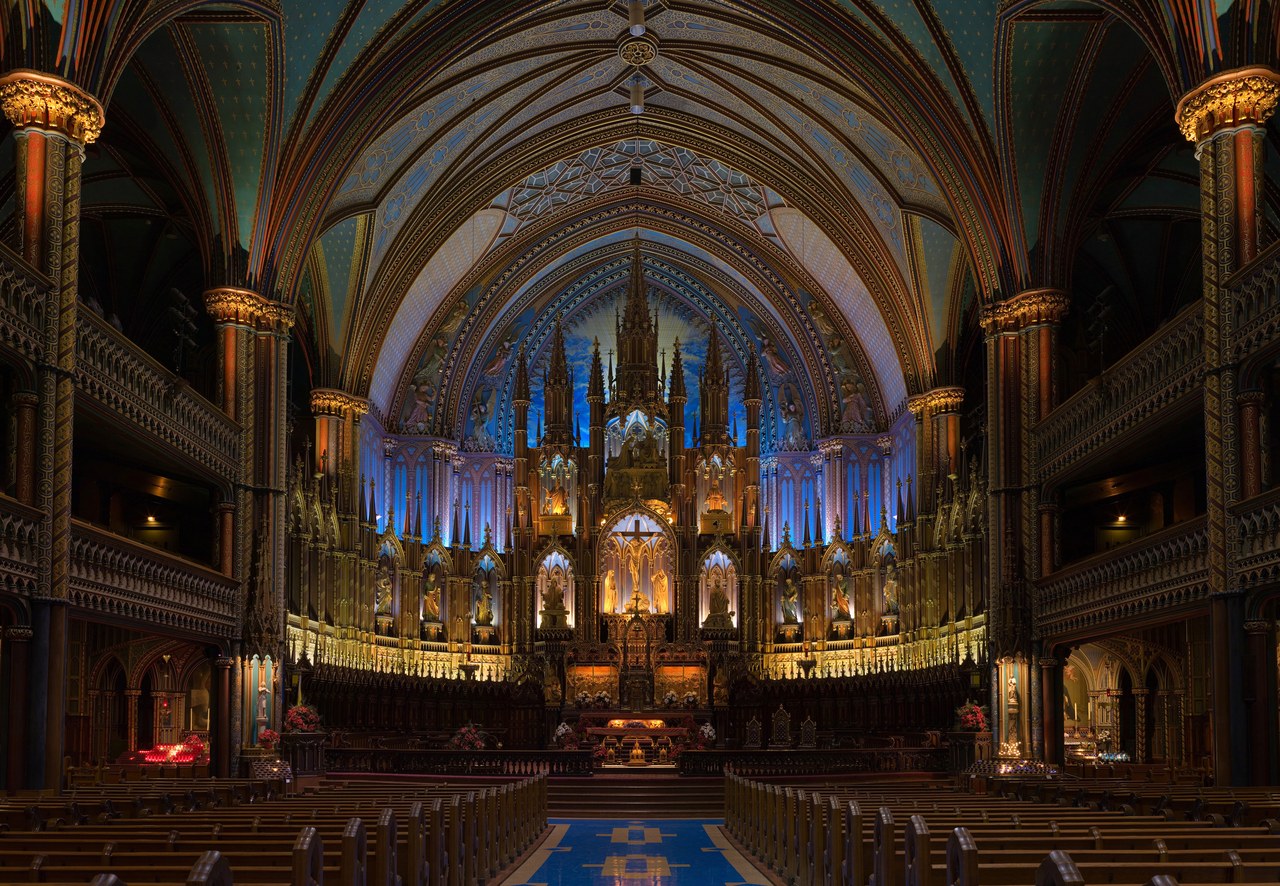 The starry blue ceiling and carved wooden altar of Notre-Dame Basilica in Montreal