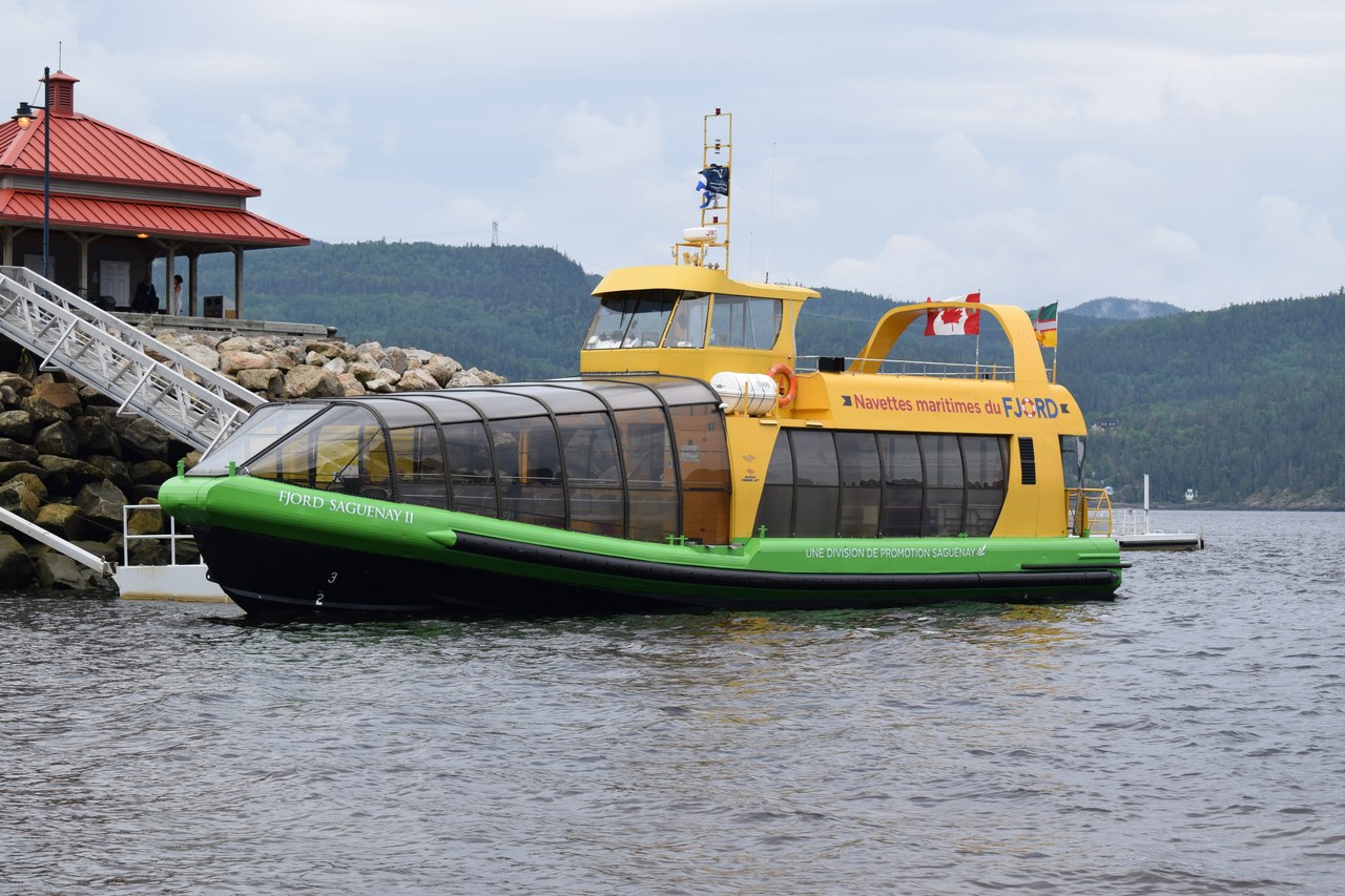 The Fjord Saguenay II cruise boat docked at a wharf on the Saguenay Fjord