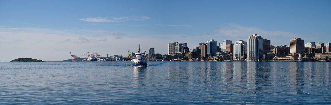 Wide panoramic view of the Halifax skyline across the harbour on a clear summer day