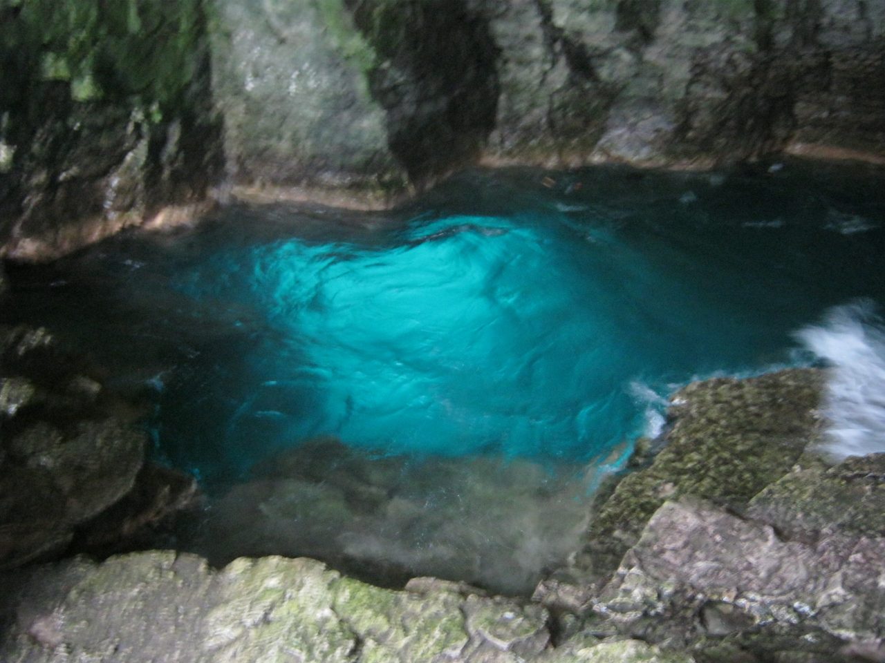 Turquoise water inside the limestone sea cave known as the Grotto in Bruce Peninsula National Park