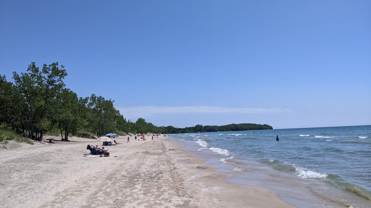 Wide sandy shoreline at Lakeshore Beach in Sandbanks Provincial Park, Prince Edward County