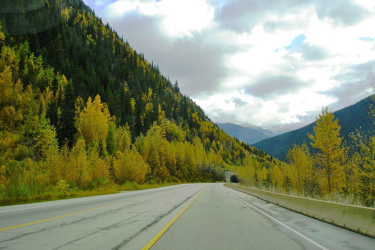 Highway 1 winding through the steep forested walls of the Fraser Canyon in autumn colours