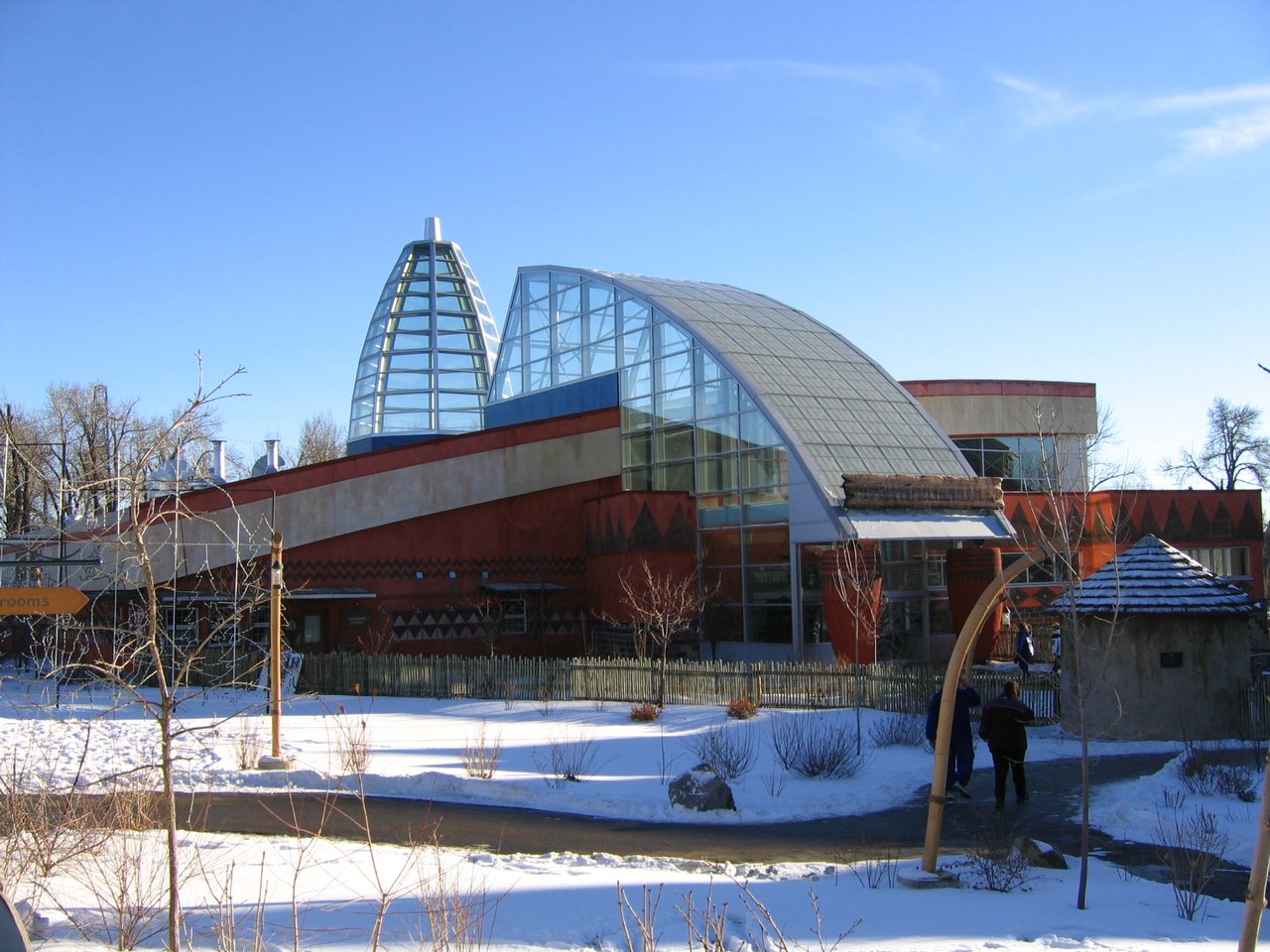 The glass-roofed Destination Africa building at the Wilder Institute Calgary Zoo on a bright winter day