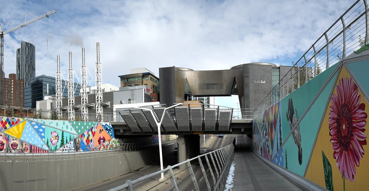 The copper-toned, curved glass facade of Studio Bell, home of the National Music Centre, in Calgary's East Village
