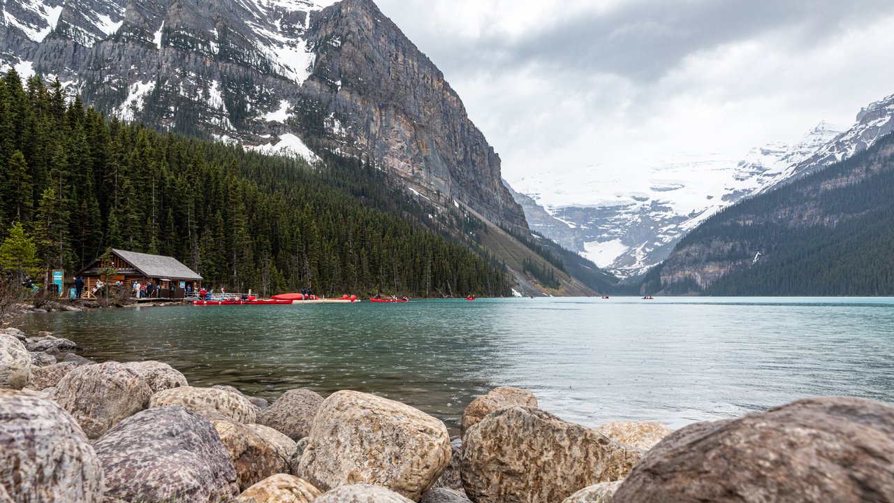 Turquoise Lake Louise framed by forested peaks in Banff National Park, an easy day trip from Calgary
