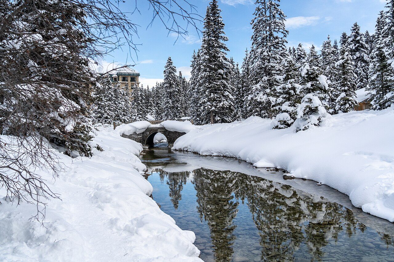 Fresh snow on Lake Louise in winter, Banff National Park, with peaks behind