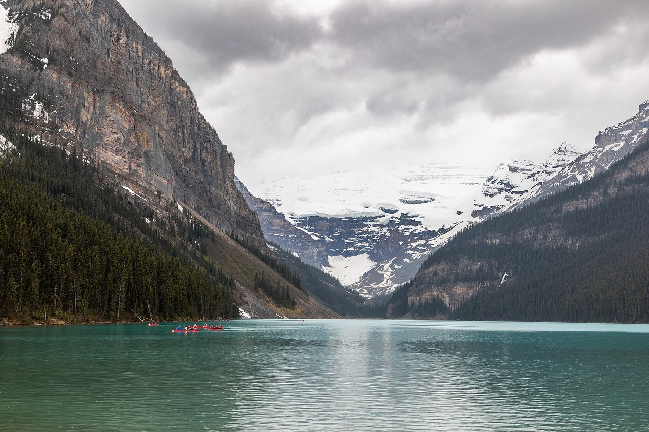 Turquoise waters of Lake Louise in Banff National Park with Victoria Glacier and surrounding peaks