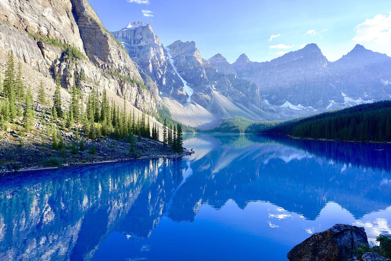 Turquoise Moraine Lake in June with the Valley of the Ten Peaks still dusted in snow