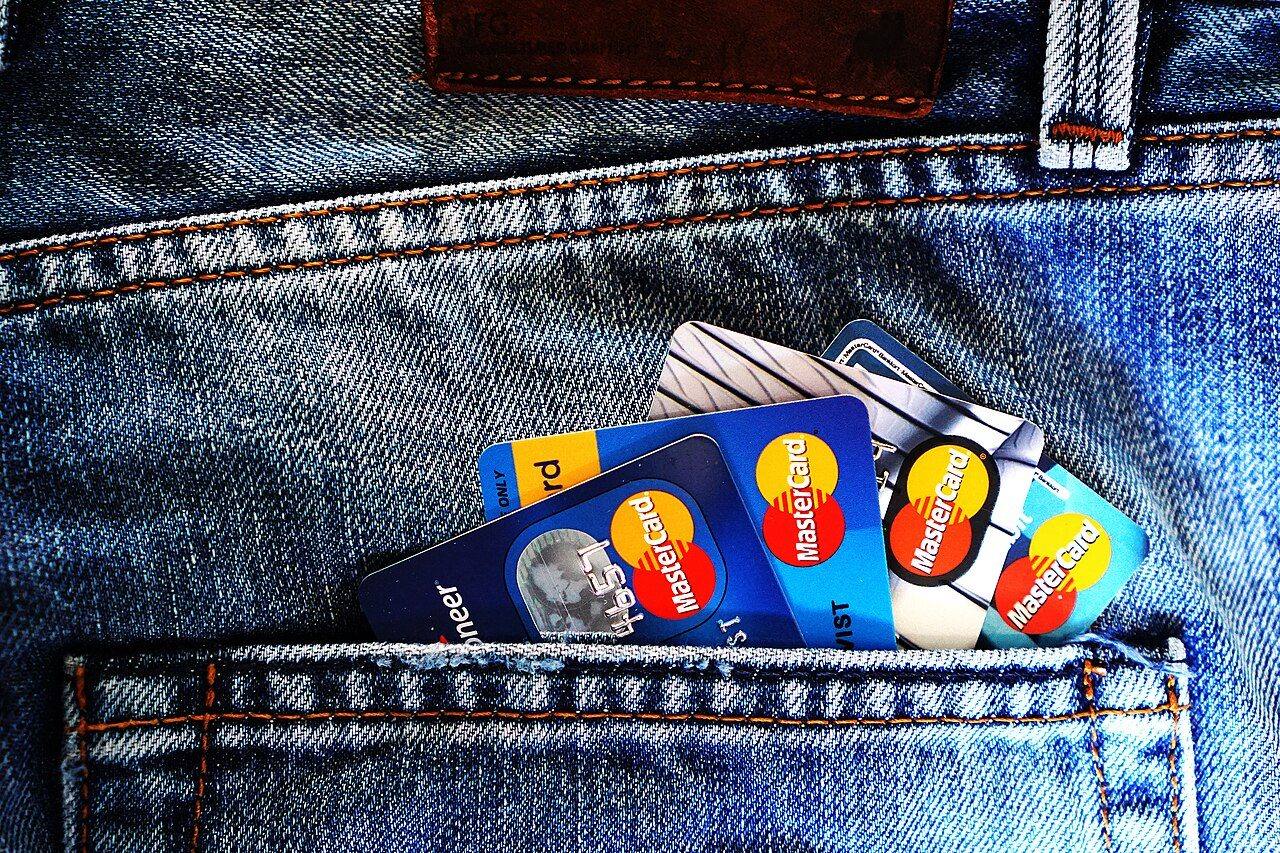 Credit cards tucked into the back pocket of a pair of jeans