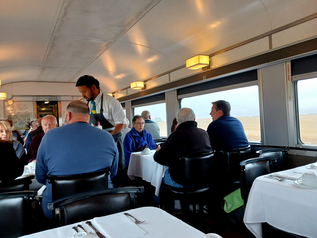 Interior of the dining car on VIA Rail's Canadian with set tables