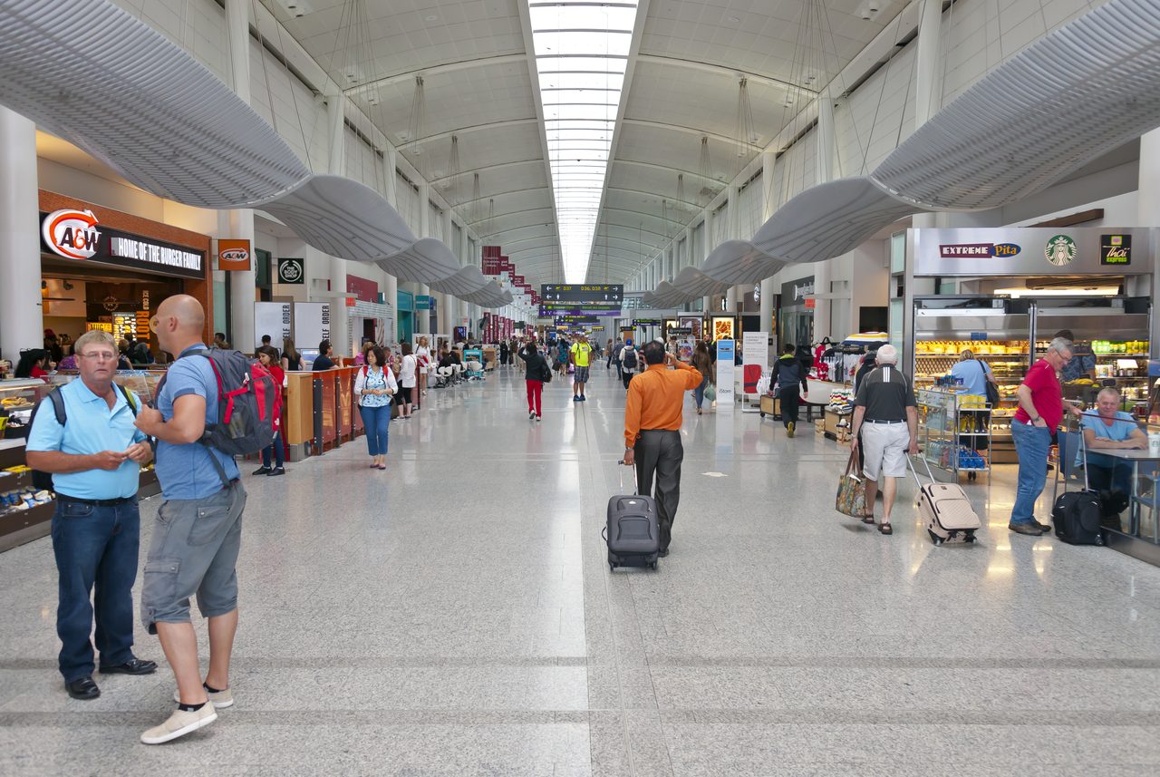 Wide view of the departures hall inside Terminal 1 at Toronto Pearson International Airport