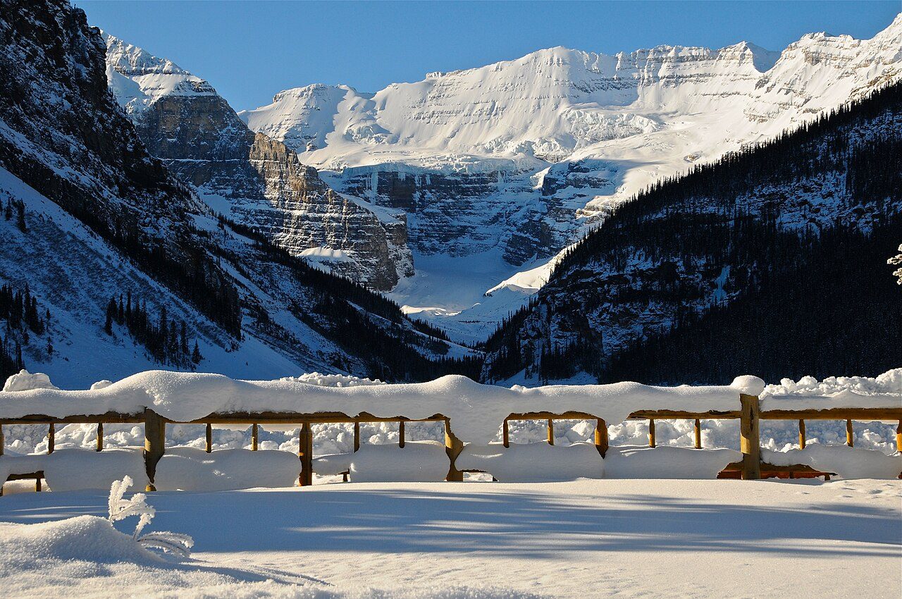 Lake Louise frozen and snow-covered in deep winter with Victoria Glacier rising behind