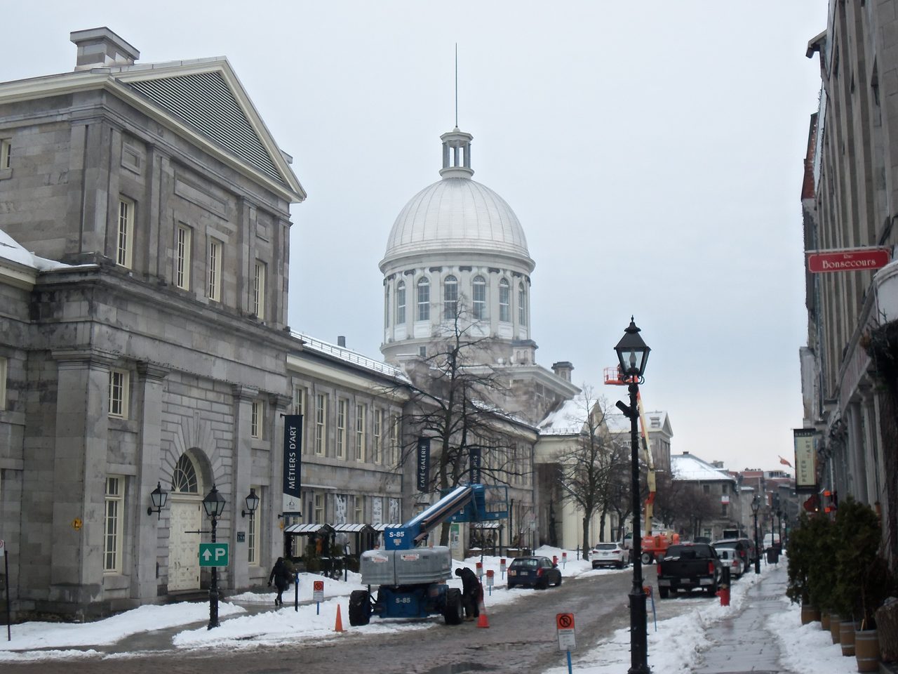 A cobblestone street lined with historic stone buildings in Old Montreal